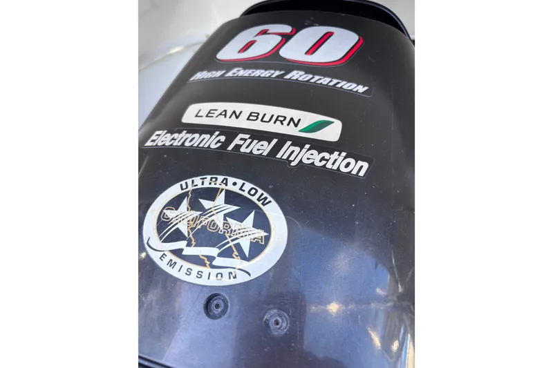 Slide: The Image of Outboard motor cover with "60 High Energy Rotation," "Lean Burn," and "Electronic Fuel Injection" labels. - 20