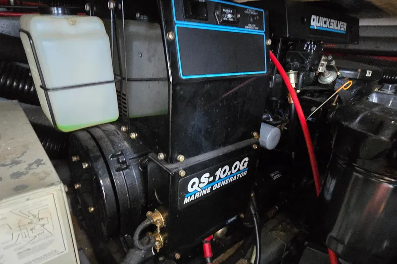 Slide: The Image of Marine generator in a 1990 Sea Ray Sundancer 350 engine compartment. - 32
