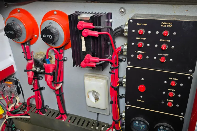 Slide: The Image of Electrical panel of a 1990 Sea Ray Sundancer 350 boat, featuring switches and wiring. - 25