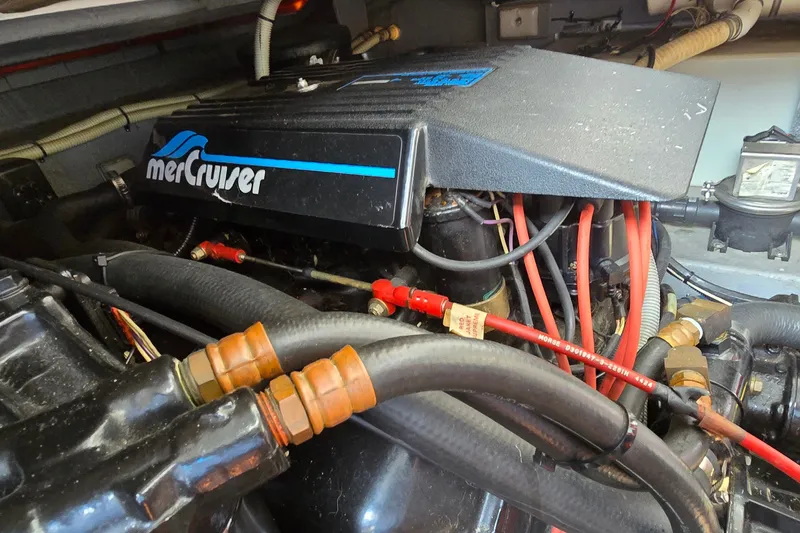 Slide: The Image of Engine compartment of a 1990 Sea Ray Sundancer 350 with MerCruiser components. - 30