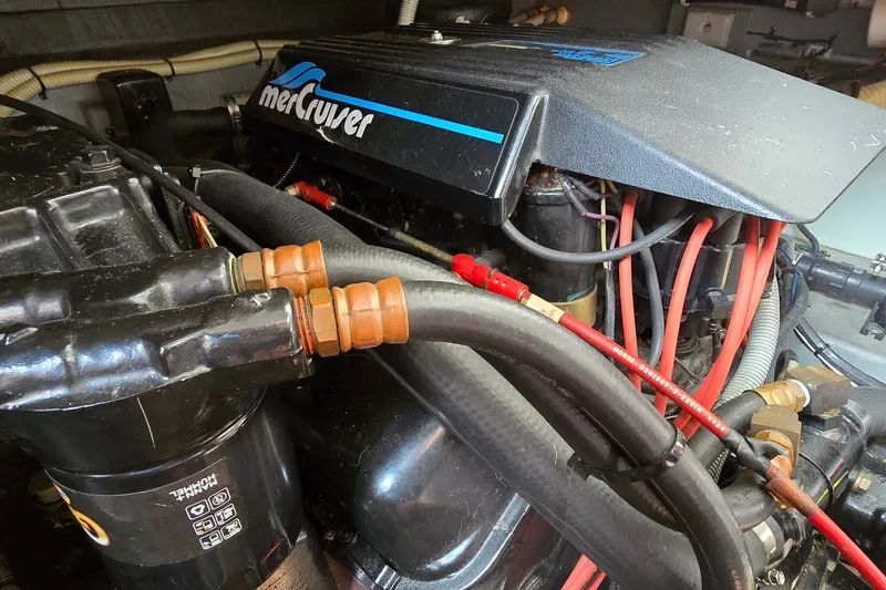 Slide: The Image of Engine compartment of a 1990 Sea Ray Sundancer 350 with MerCruiser components. - 27