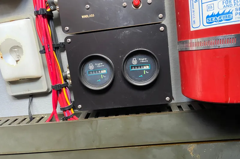 Slide: The Image of Engine hour meters and wiring on a 1990 Sea Ray Sundancer 350 boat. - 34