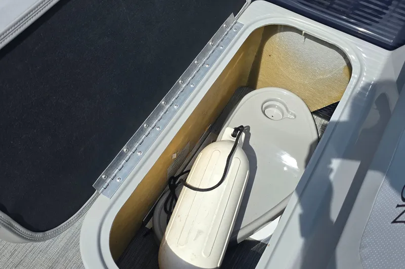 Slide: The Image of Storage compartment in 2022 Bennington SX 22 Fishing boat with fender and cover. - 10
