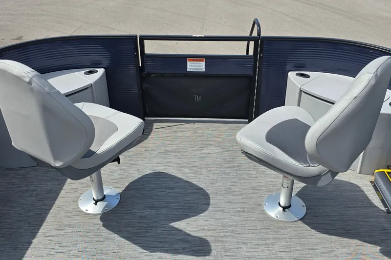 Slide: The Image of 2022 Bennington SX 22 Fishing boat interior with two swivel seats and storage compartments. - 9