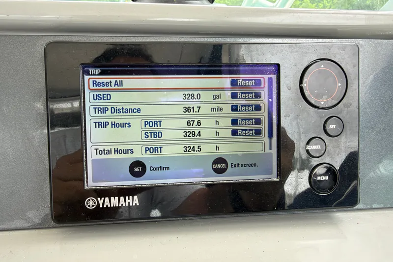 Slide: The Image of Yamaha display on 2014 Robalo R305 Walkaround showing trip data and settings. - 28