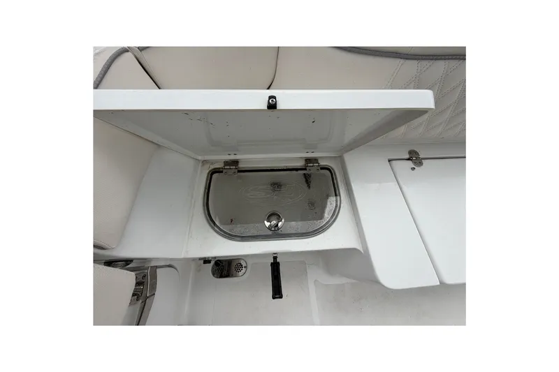 Slide: The Image of Open storage compartment on 2026 Sea Hunt Ultra 265SE boat interior. - 12