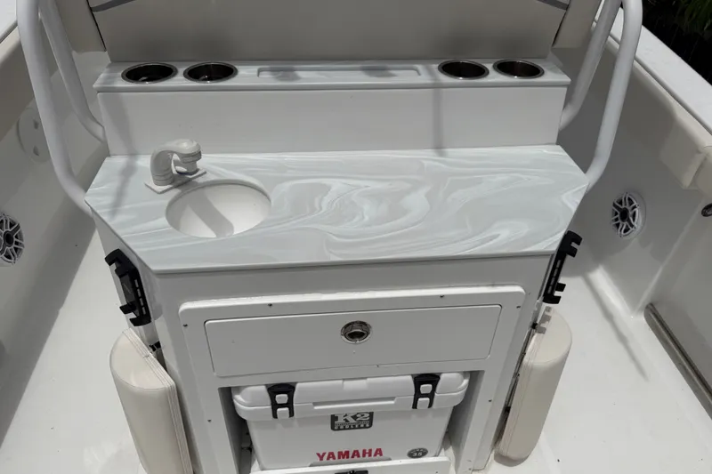 Slide: The Image of Interior of 2026 Sea Hunt Ultra 265SE boat with sink and storage area. - 7