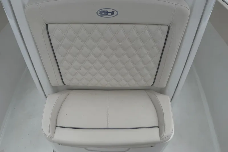 Slide: The Image of Luxurious seating on 2026 Sea Hunt Ultra 265SE boat, featuring diamond-stitched upholstery. - 14
