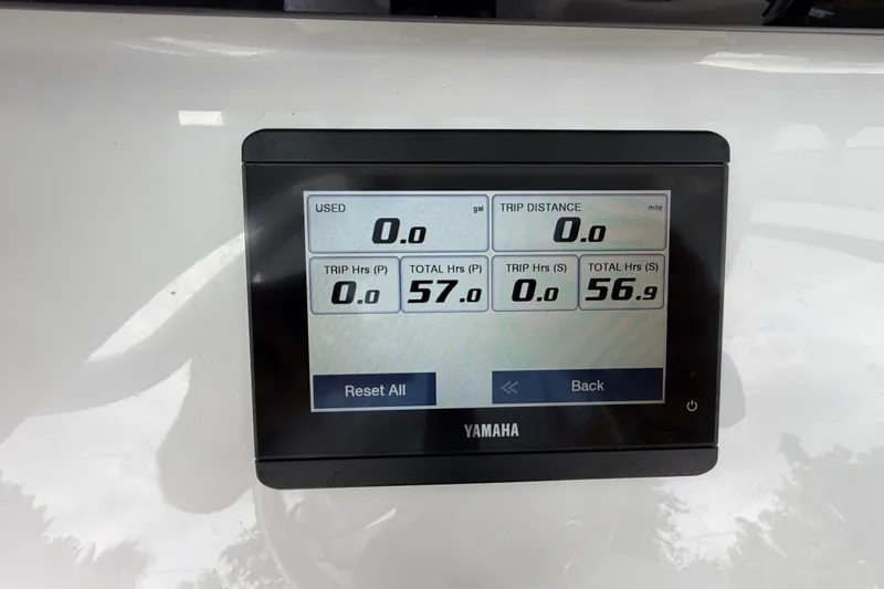 Slide: The Image of Yamaha display on 2026 Sea Hunt Ultra 265SE showing trip and usage data. - 8