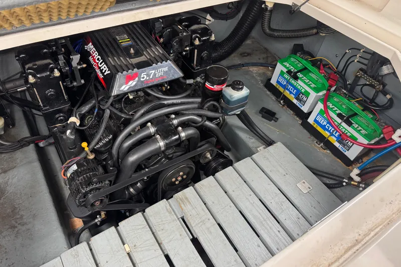 Slide: The Image of Engine compartment of 2002 Sea Ray Sundancer 260 with Mercury 5.7L EFI engine. - 13