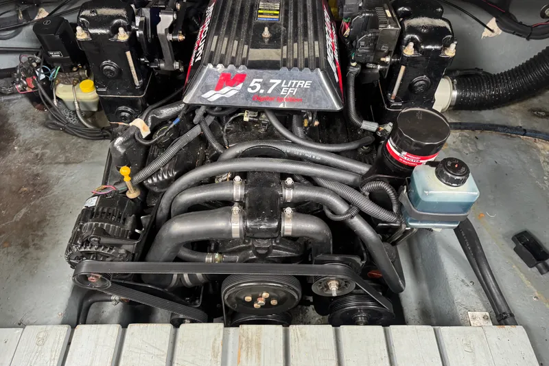 Slide: The Image of Engine of a 2002 Sea Ray Sundancer 260 boat, featuring a 5.7-liter EFI motor. - 14