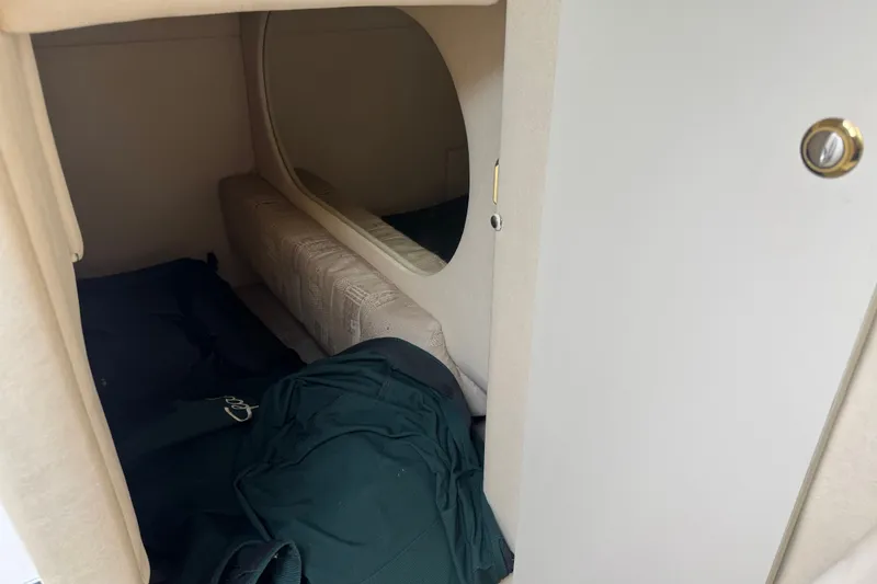 Slide: The Image of Interior cabin of 2002 Sea Ray Sundancer 260 with cozy sleeping area. - 23