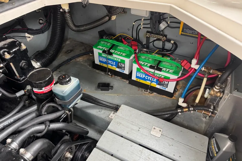 Slide: The Image of Engine compartment of a 2002 Sea Ray Sundancer 260 with Interstate deep cycle batteries. - 16