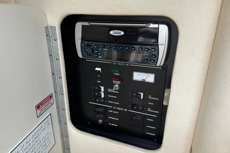 Slide: The Image of Electrical control panel on a 2002 Sea Ray Sundancer 260 boat. - 25
