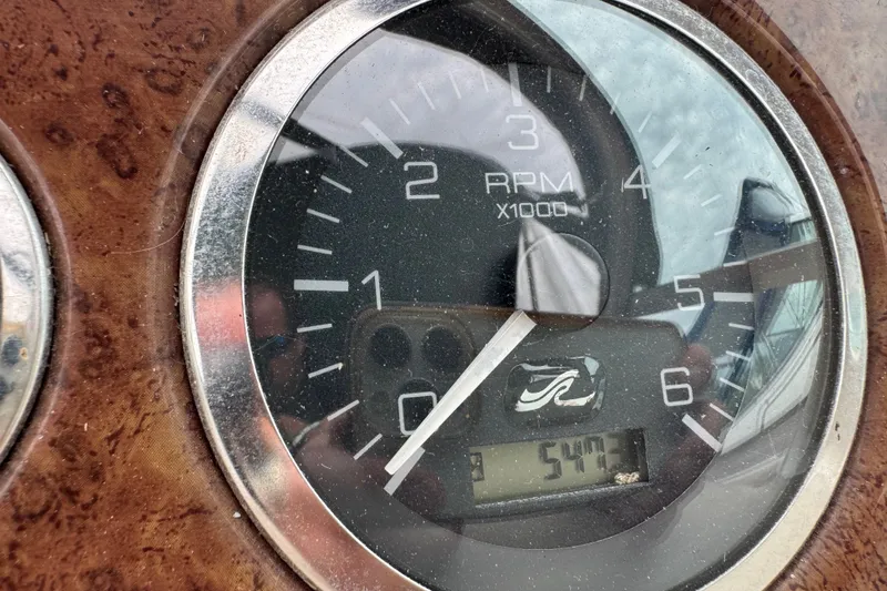 Slide: The Image of Close-up of a 2002 Sea Ray Sundancer 260 RPM gauge displaying 547.3 hours. - 17