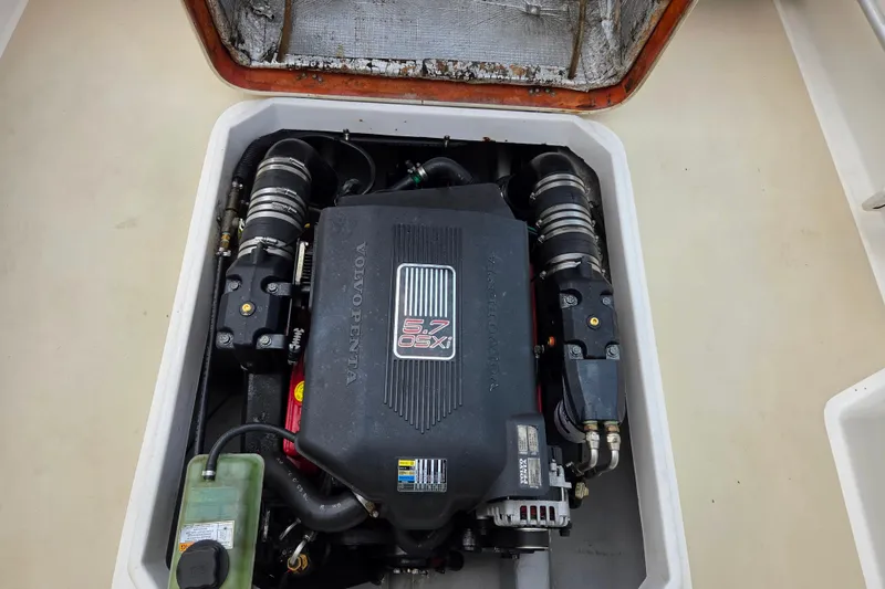 Slide: The Image of Engine compartment of a 2004 Hunt Yachts Surfhunter 25 with Volvo Penta 5.7 OSXi engine. - 12