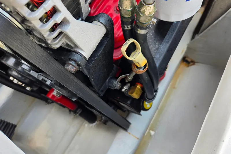 Slide: The Image of Engine components of a 2004 Hunt Yachts Surfhunter 25, showcasing detailed mechanical parts. - 9