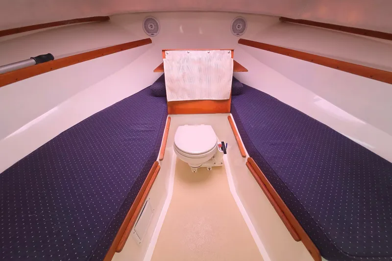 Slide: The Image of Interior cabin of 2004 Hunt Yachts Surfhunter 25 with twin berths and marine toilet. - 26