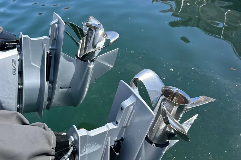 Slide: The Image of Twin propellers of a 2024 Axopar 37 XC Cross Cabin boat in water. - 7