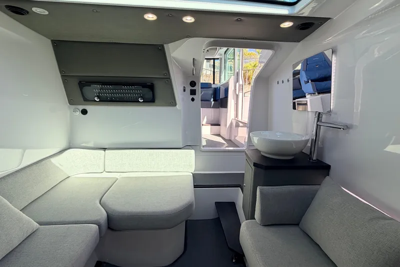 Slide: The Image of Luxurious interior of 2024 Axopar 37 XC Cross Cabin with modern seating and sleek design. - 27