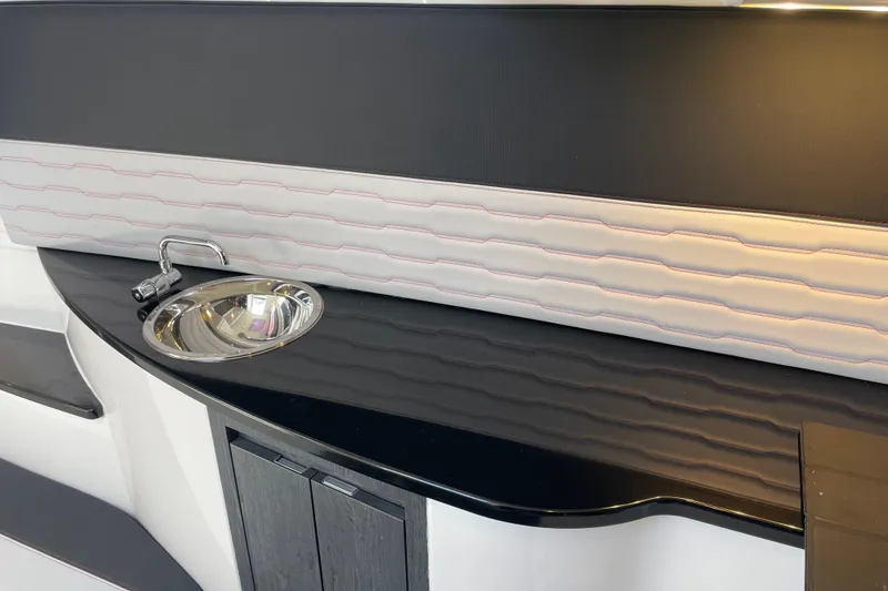 Slide: The Image of Interior of 2023 Cigarette 41' Nighthawk featuring sleek sink and modern design. - 16