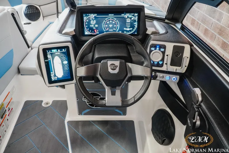 Slide: The Image of 2024 Malibu Wakesetter 23 LSV dashboard with advanced controls and digital displays. - 11