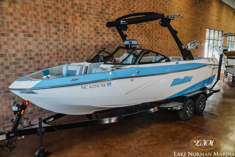 Slide: The Image of 2024 Malibu Wakesetter 23 LSV boat displayed at Lake Norman Marina. - 2