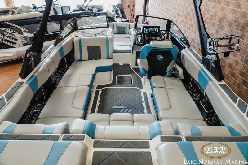 Slide: The Image of 2024 Malibu Wakesetter 23 LSV interior with spacious seating and modern dashboard at Lake Norman Marina. - 7