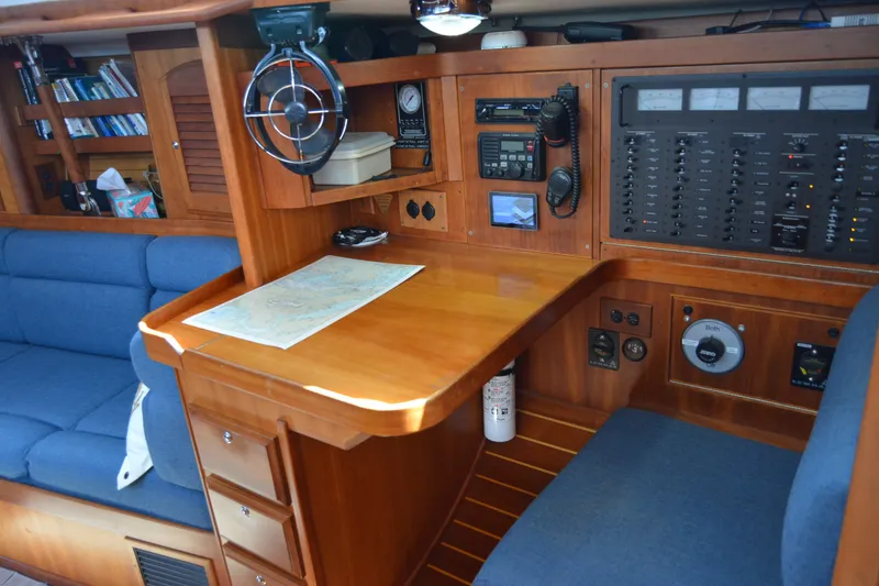 Slide: The Image of Navigation station in a 2002 Sabre 402 sailboat with chart table and control panel. - 108
