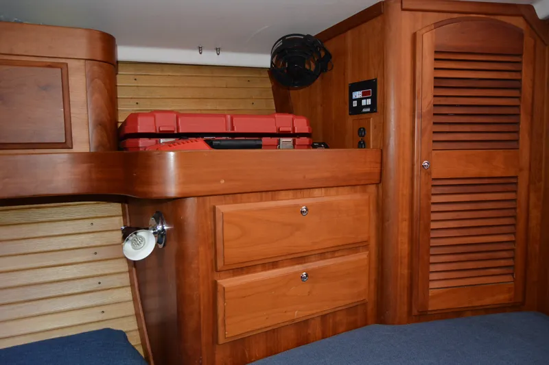 Slide: The Image of Interior of a 2002 Sabre 402 yacht with wooden cabinetry and storage. - 133