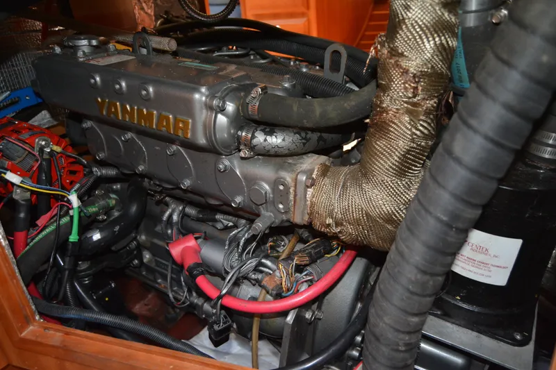 Slide: The Image of Engine compartment of a 2002 Sabre 402 sailboat featuring a Yanmar engine. - 137