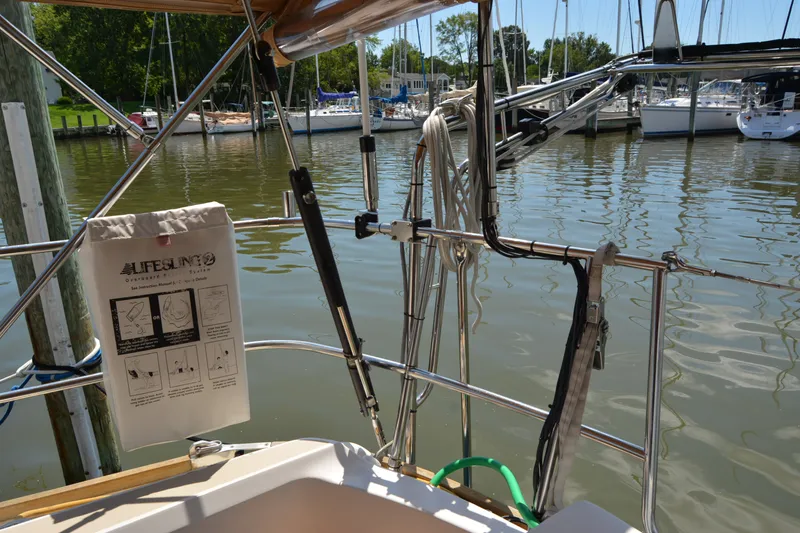 Slide: The Image of Sailboat deck view with safety equipment, docked in a marina, Sabre 402, 2002 model. - 57
