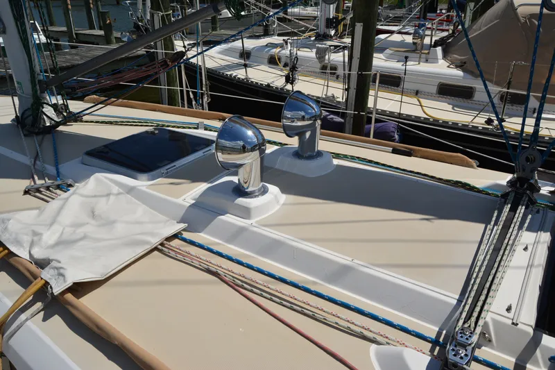 Slide: The Image of Deck of 2002 Sabre 402 sailboat with polished fittings and rigging at marina. - 47