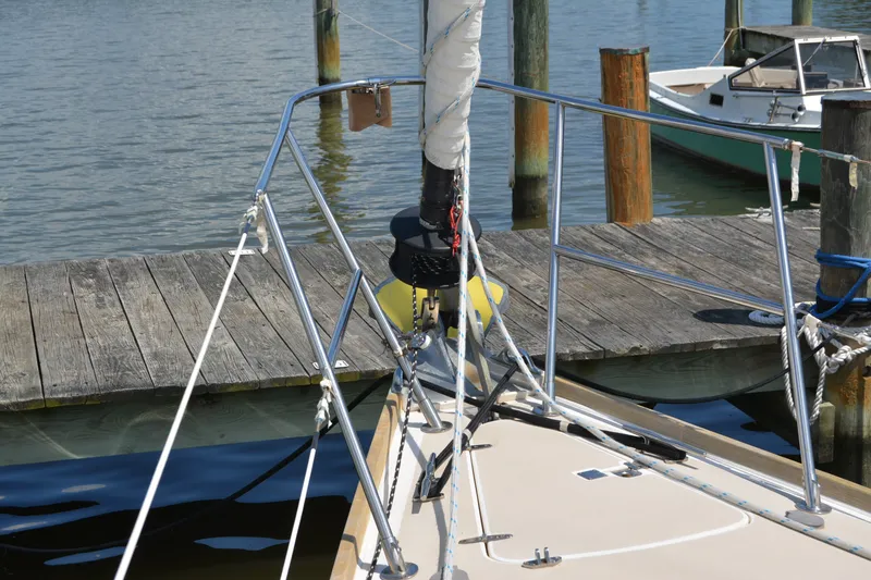 Slide: The Image of Bow of 2002 Sabre 402 sailboat docked at a wooden pier. - 27