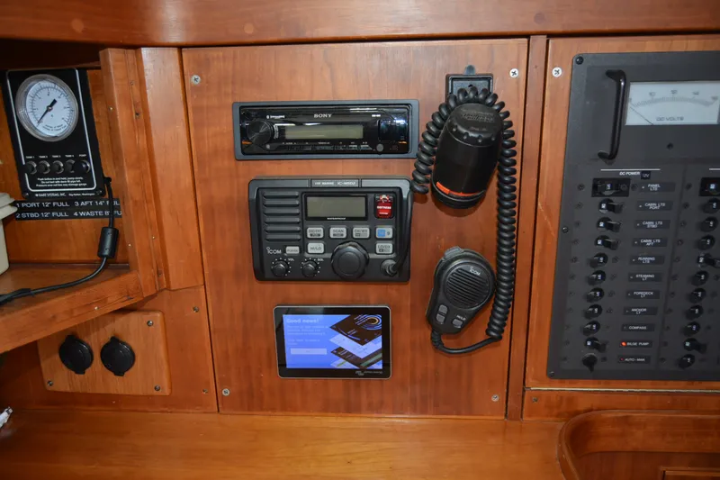 Slide: The Image of Control panel of a 2002 Sabre 402 yacht with communication and navigation equipment. - 110