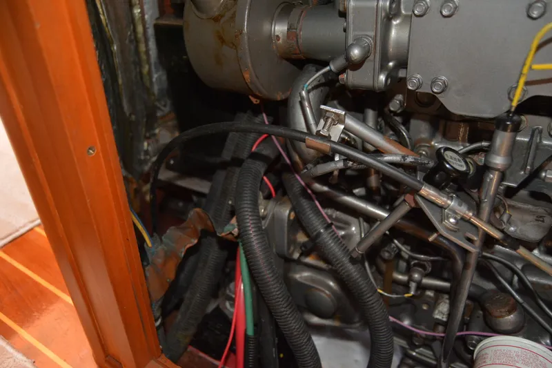 Slide: The Image of Engine compartment of a 2002 Sabre 402, showcasing intricate wiring and mechanical components. - 140