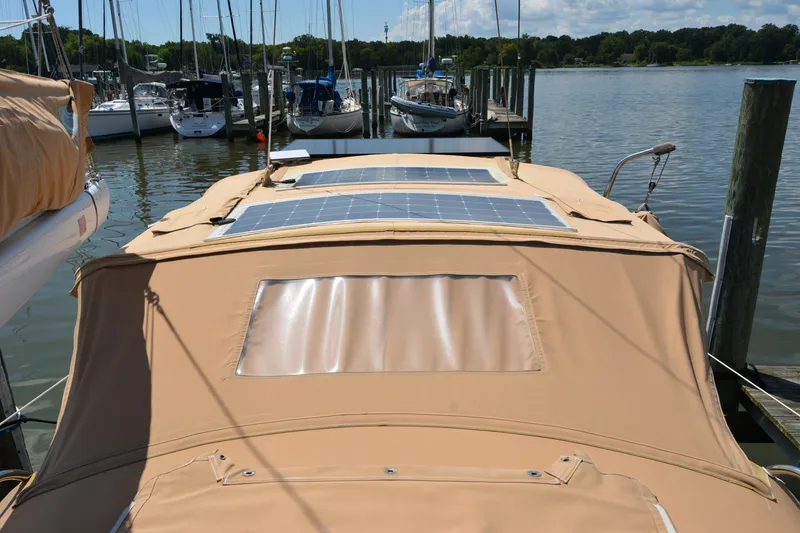 Slide: The Image of 2002 Sabre 402 sailboat with solar panels docked at a marina. - 50