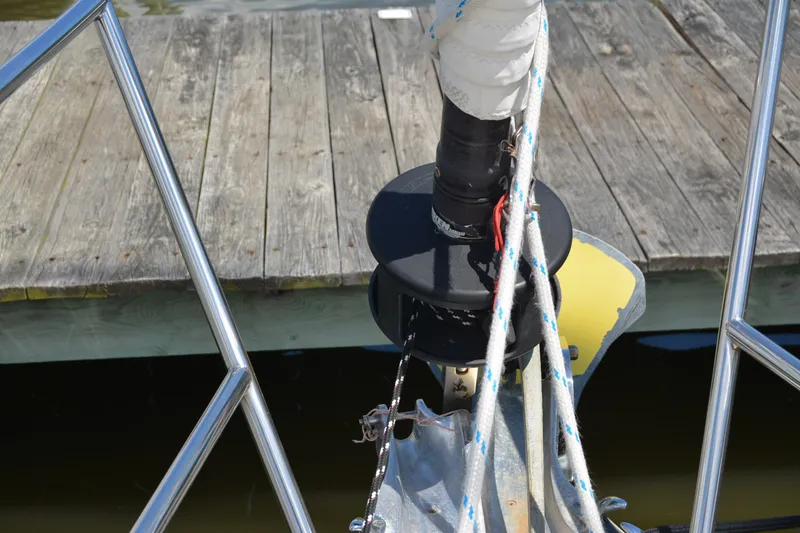 Slide: The Image of Bow of 2002 Sabre 402 sailboat with ropes and dock in background. - 30