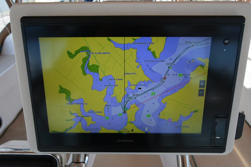 Slide: The Image of Garmin marine GPS displaying a detailed nautical map on a Sabre 402, 2002 model. - 60