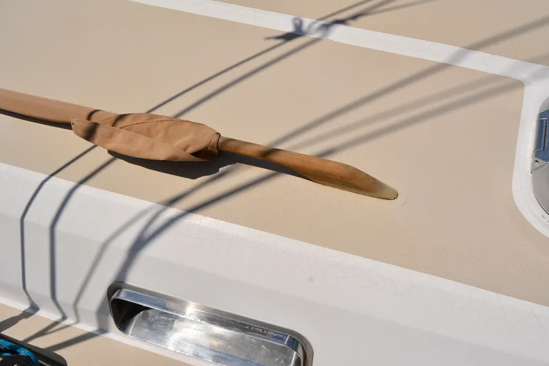 Slide: The Image of Deck of 2002 Sabre 402 sailboat with covered wooden handrail. - 40