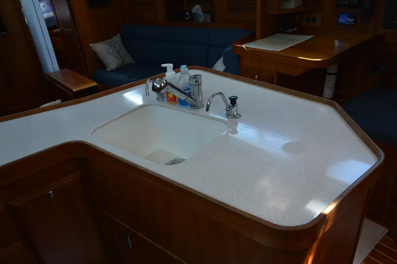 Slide: The Image of Luxurious Sabre 402 yacht interior with modern kitchen sink, 2002 model. - 77