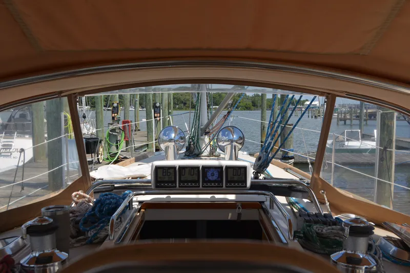 Slide: The Image of View from the cockpit of a 2002 Sabre 402 sailboat docked at a marina. - 62