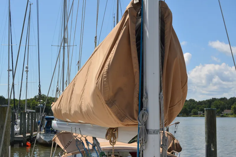 Slide: The Image of Sailboat mast with covered sail, Sabre 402, 2002 model, docked at marina. - 36