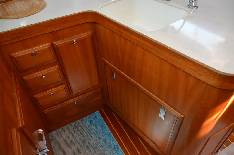 Slide: The Image of Wooden cabinetry and sink in 2002 Sabre 402 yacht interior. - 78