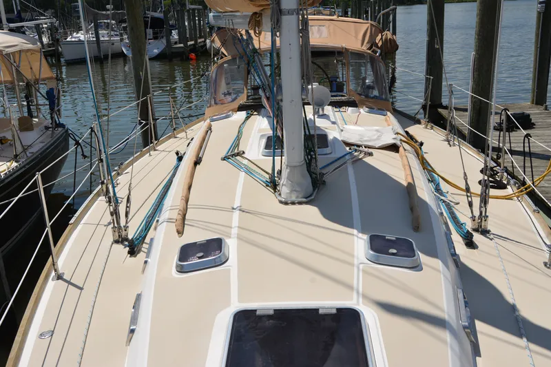 Slide: The Image of 2002 Sabre 402 sailboat deck with rigging, docked at marina. - 38