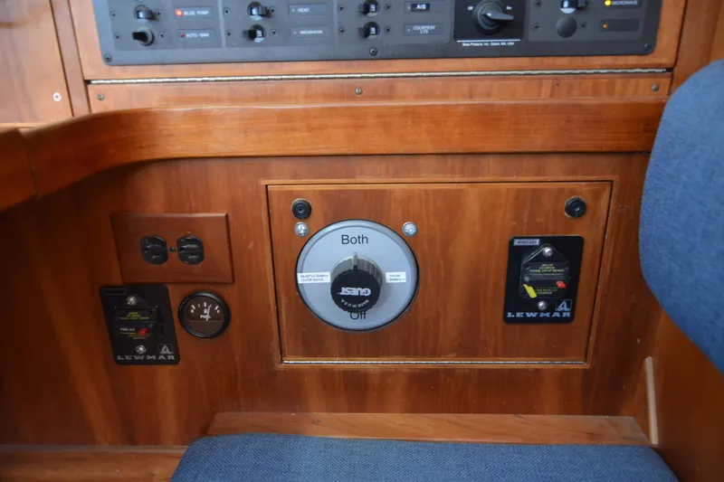 Slide: The Image of Control panel of a 2002 Sabre 402 yacht with Lewmar switches and battery selector. - 112