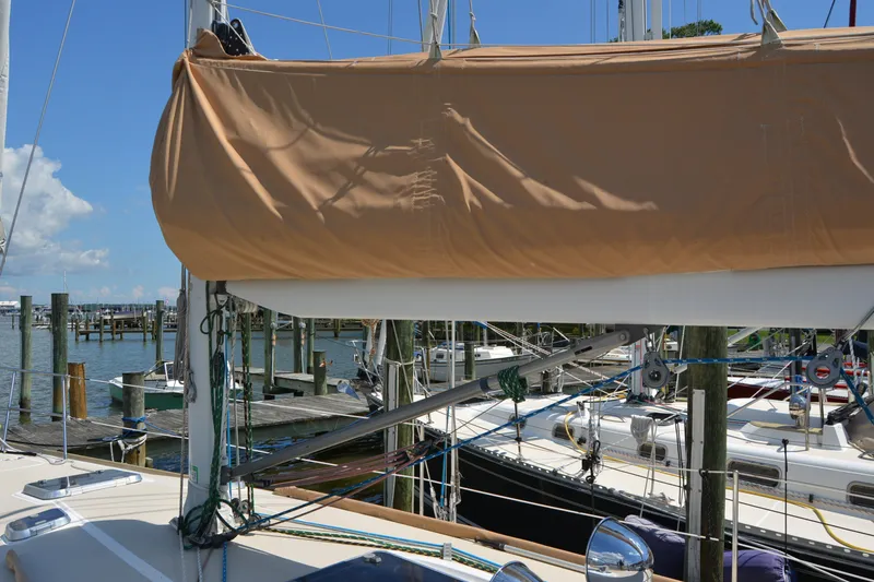 Slide: The Image of Sailboat Sabre 402 (2002) docked at marina with covered mainsail. - 48
