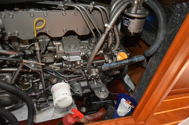 Slide: The Image of Engine compartment of a 2002 Sabre 402 sailboat, showing detailed mechanical components. - 139