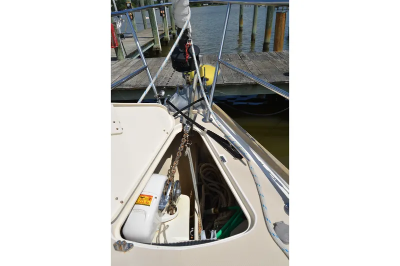 Slide: The Image of Bow of 2002 Sabre 402 sailboat with anchor chain and dock view. - 32