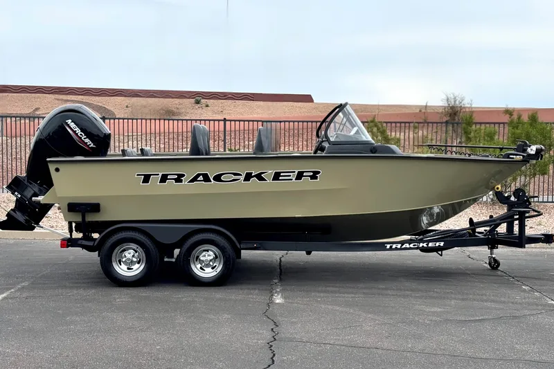The Image of 2026 Tracker Targa V-19 Combo boat on trailer, featuring Mercury outboard motor. - 0